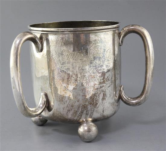 A Victorian large silver presentation tyg by Holland, Son & Slater, with horse racing related inscription, 32 oz.